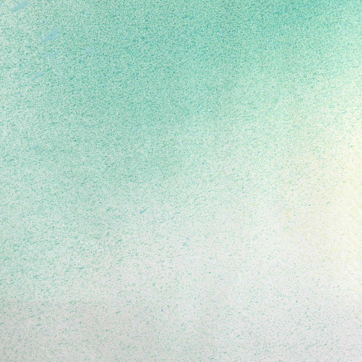 Detail of fabric in an abstract ombré paint splatter print in shades of turquoise, green and white.