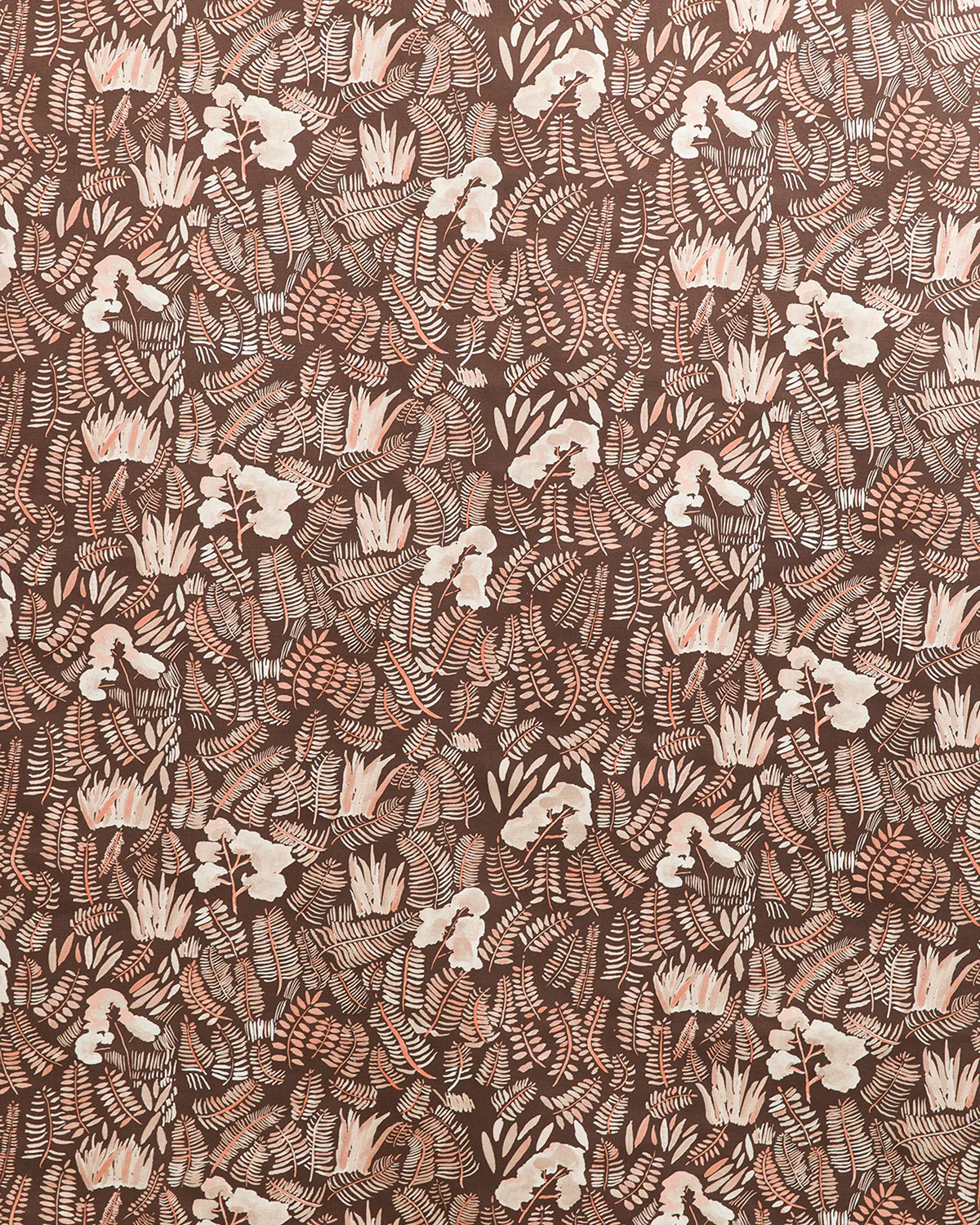 Detail of fabric in a painterly botanical print in shades of cream and pink on a brown field.