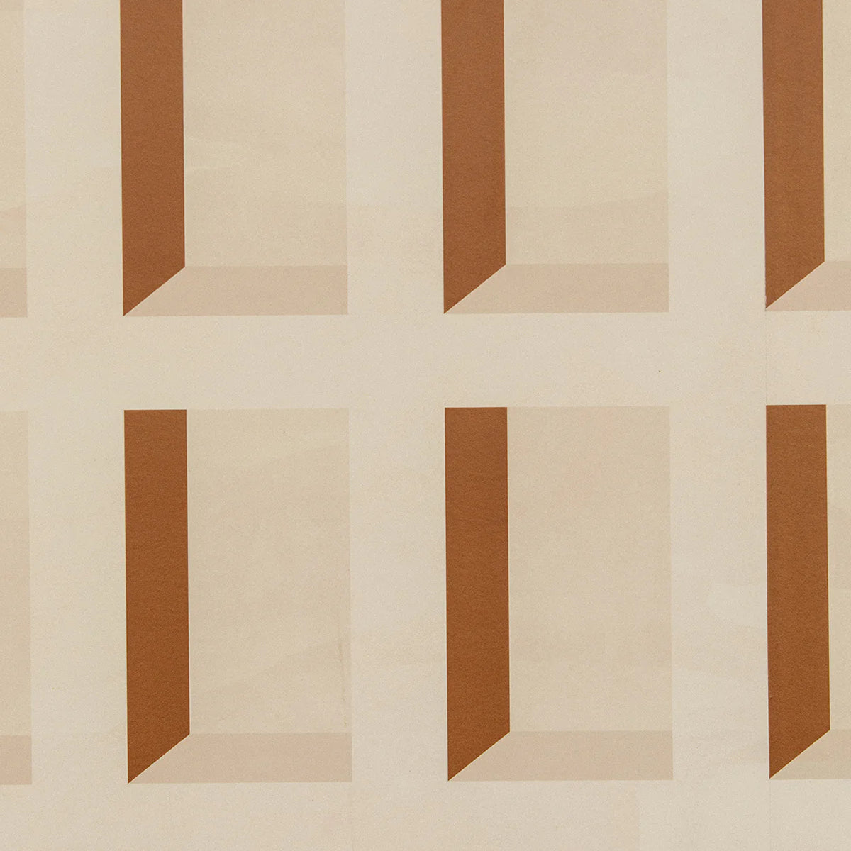 Detail of wallpaper in a dimensional grid print in shades of cream and rust.