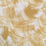 Detail of wallpaper in an abstract paint swatch print in mustard on a cream field.