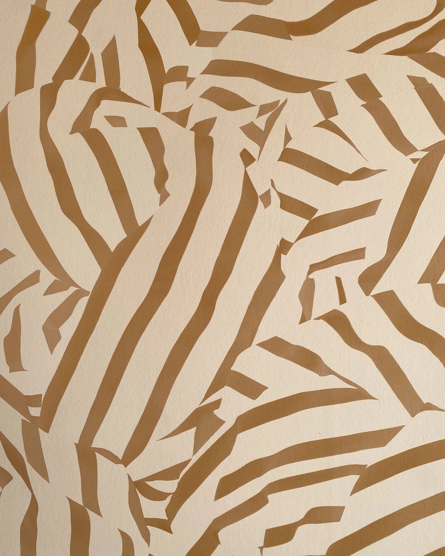 Detail of wallpaper in a playful broken stripe print in brown on a tan field.