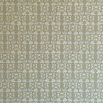 Detail of wallpaper in a linear floral print in blue and white on a green field.