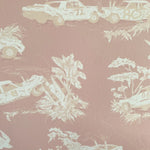 Detail of wallpaper in a playful illustrated car crash print in cream and white on a mauve field.