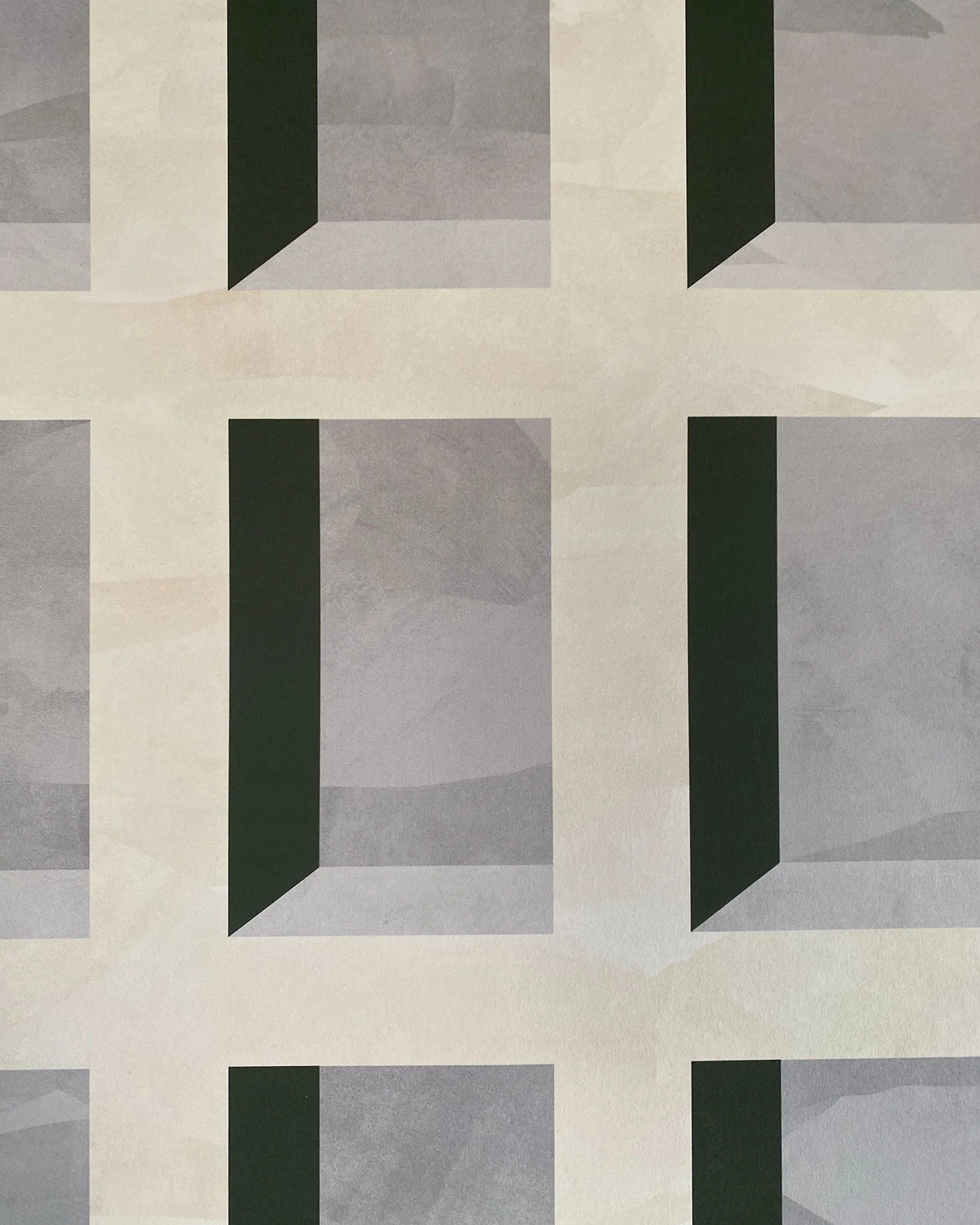 Detail of wallpaper in a dimensional grid print in shades of cream, gray and charcoal.