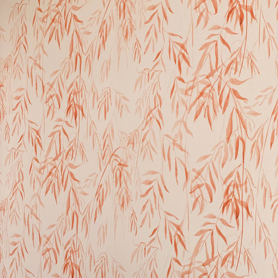 Detail of wallpaper in a painterly willow leaf print in coral on a cream field.