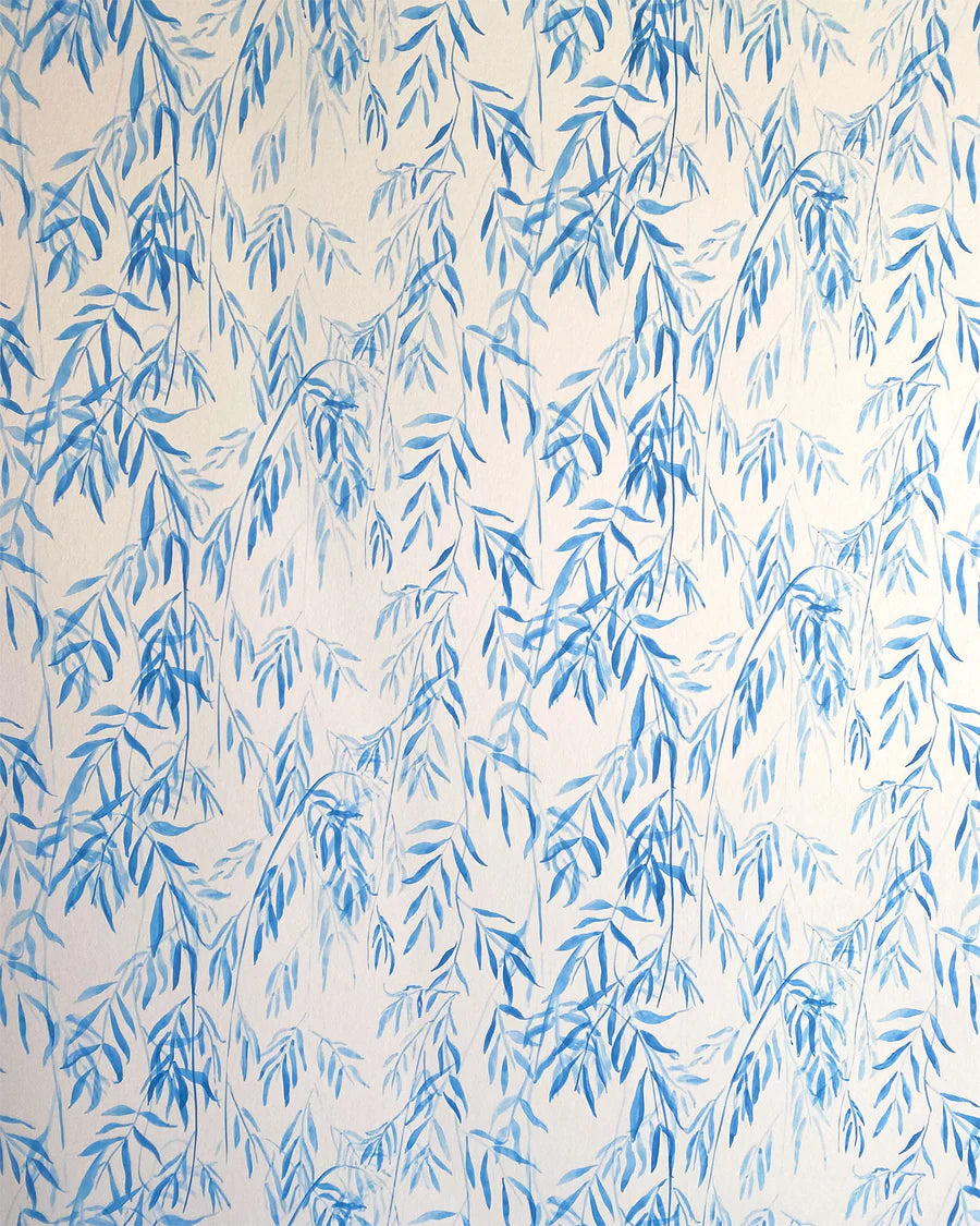 Detail of wallpaper in a painterly willow leaf print in blue on a white field.