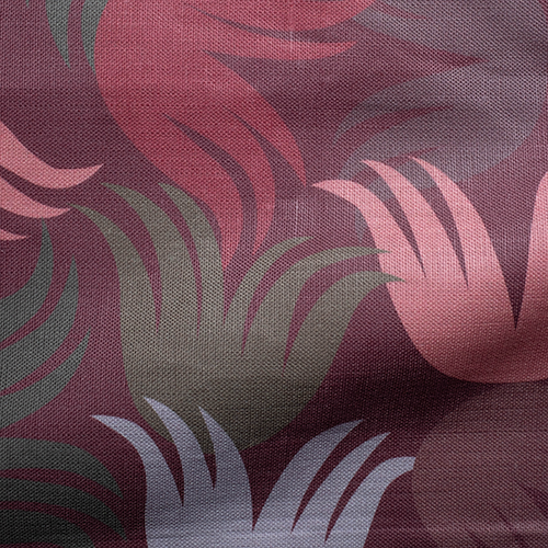 Draped fabric in a playful "floof" pattern in shades of red, pink, green and tan on a pink field.