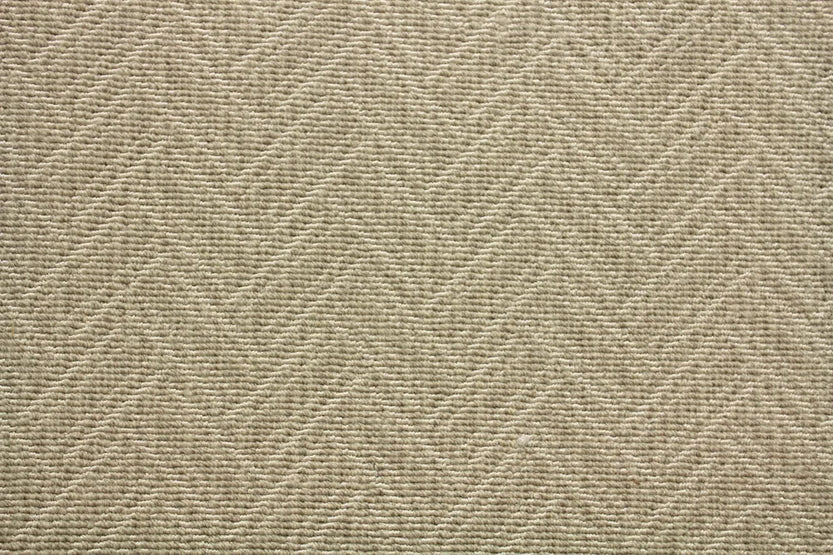 Broadloom carpet swatch in a zig zag pattern tan grey color