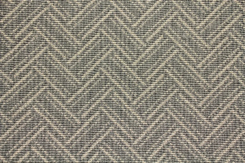 Broadloom carpet swatch in a zig zag pattern medium grey color