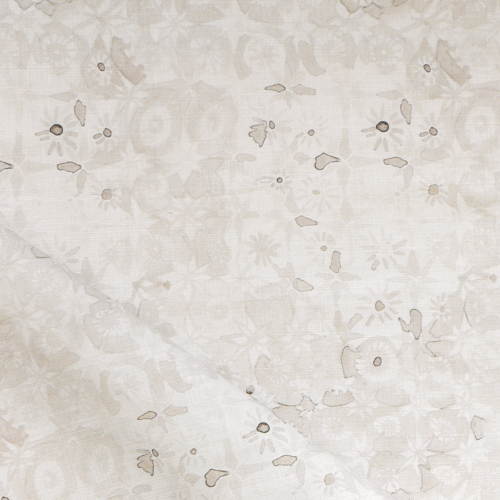 Close-up of a watercolor lace design in soft beige. 