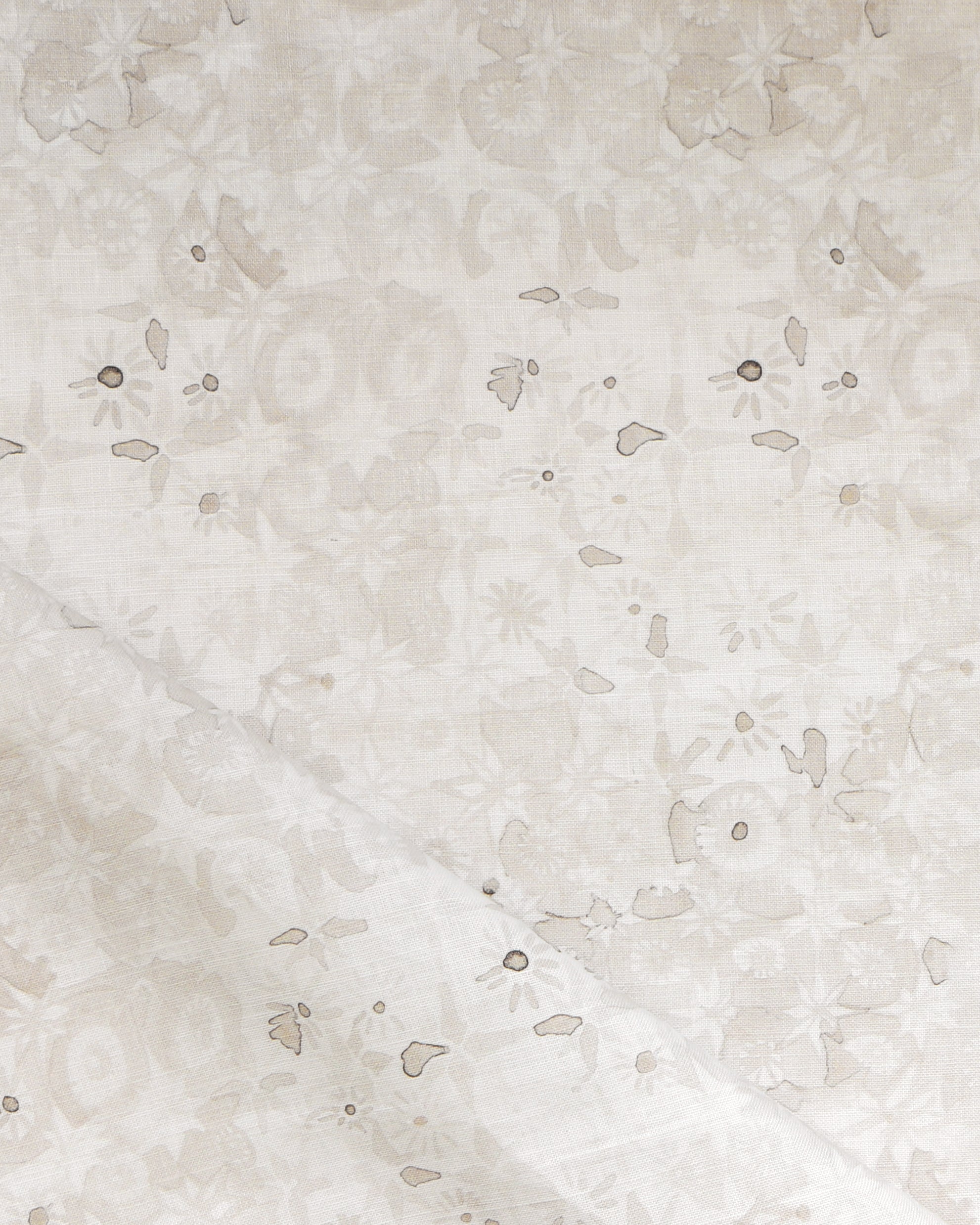 Close-up of a watercolor lace design in soft beige. 