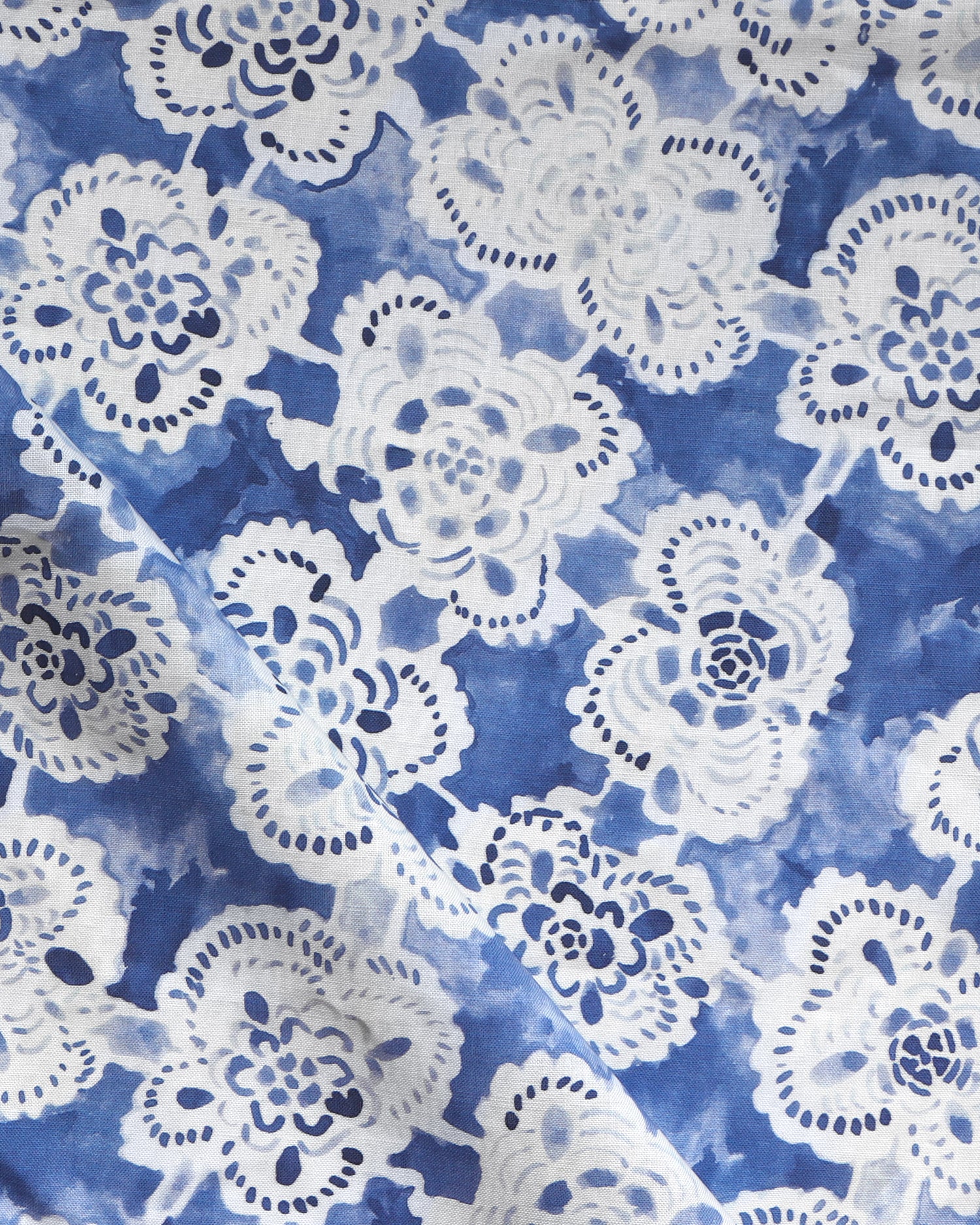 White lace-like patterns on a blue watercolor background