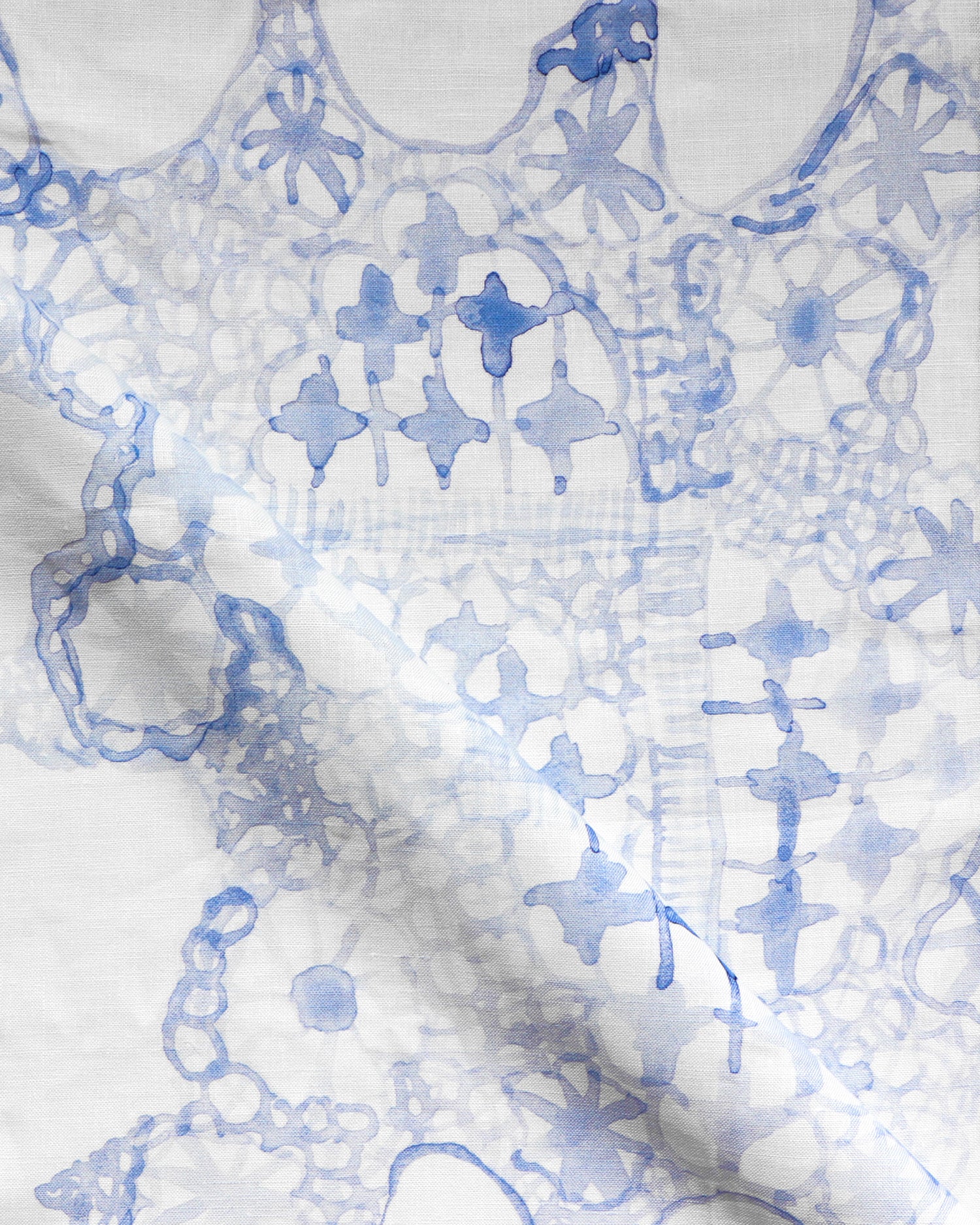Textile with blue floral pattern on a white background