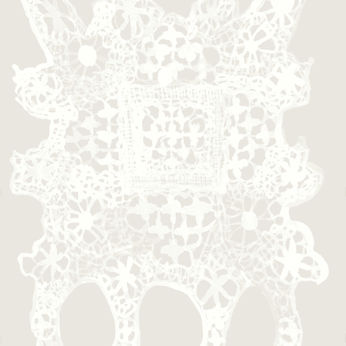 White lace doily pattern on a light gray background