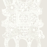 White lace doily pattern on a light gray background