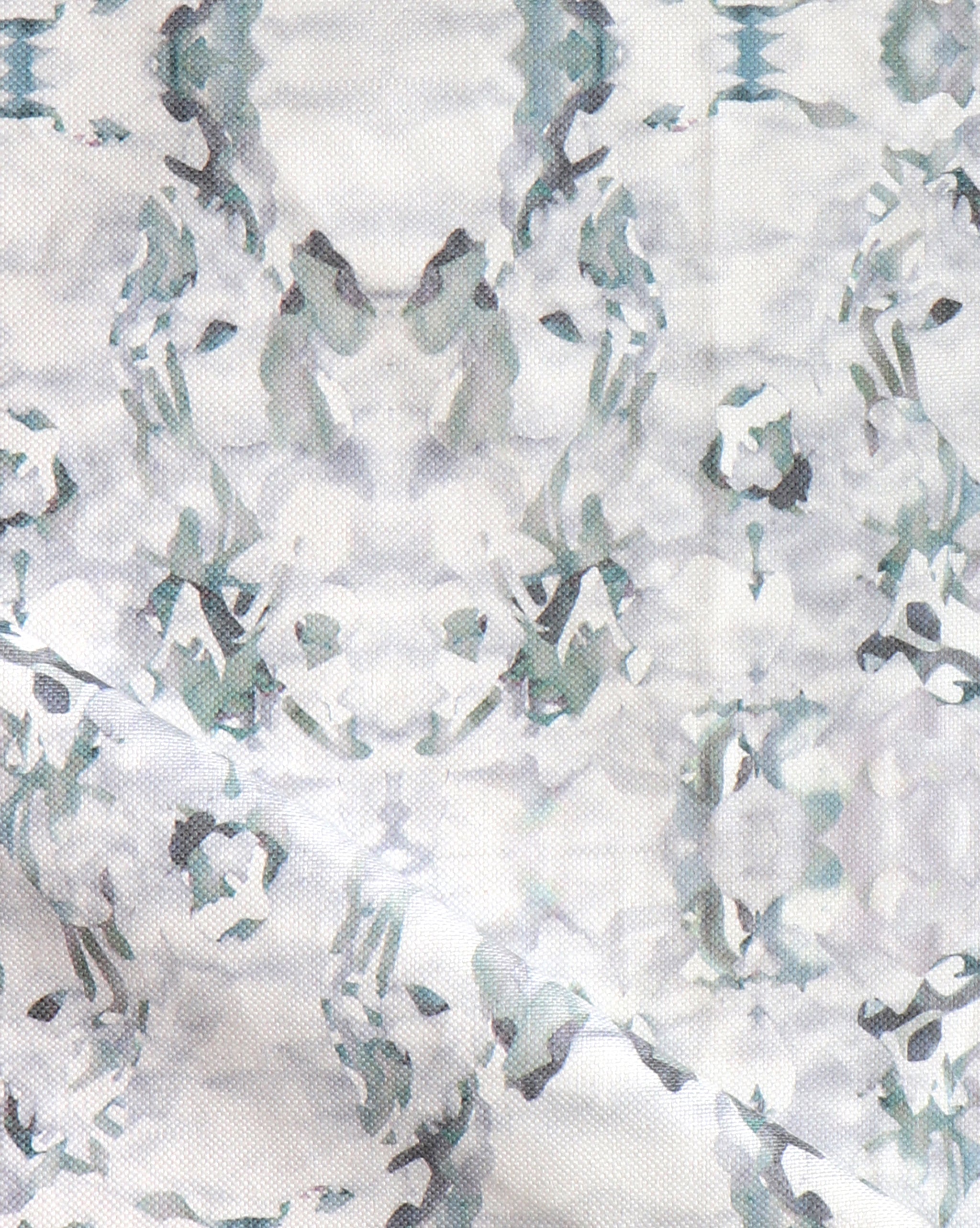 Detail of fabric in an abstract paint blotch print in gray and turquoise on a white field.