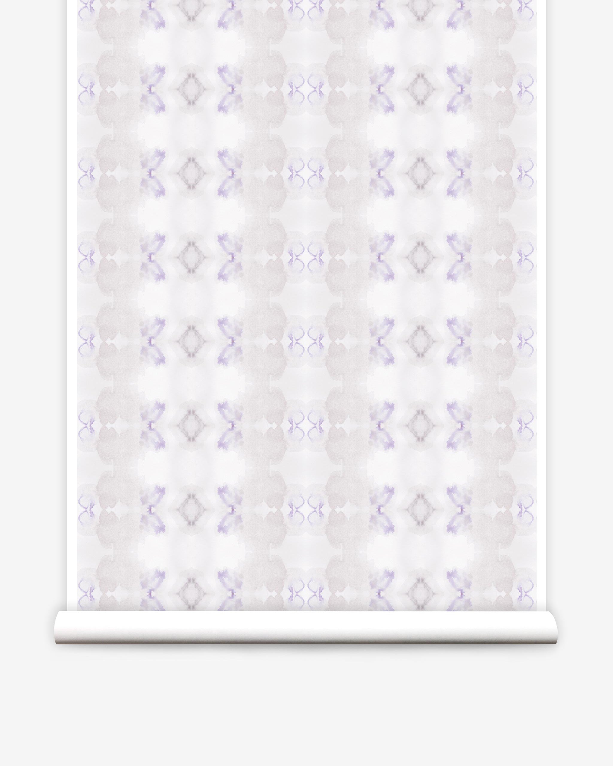 Partially unrolled wallpaper yardage in a striped ink blot print in shades of tan and purple on a cream field.