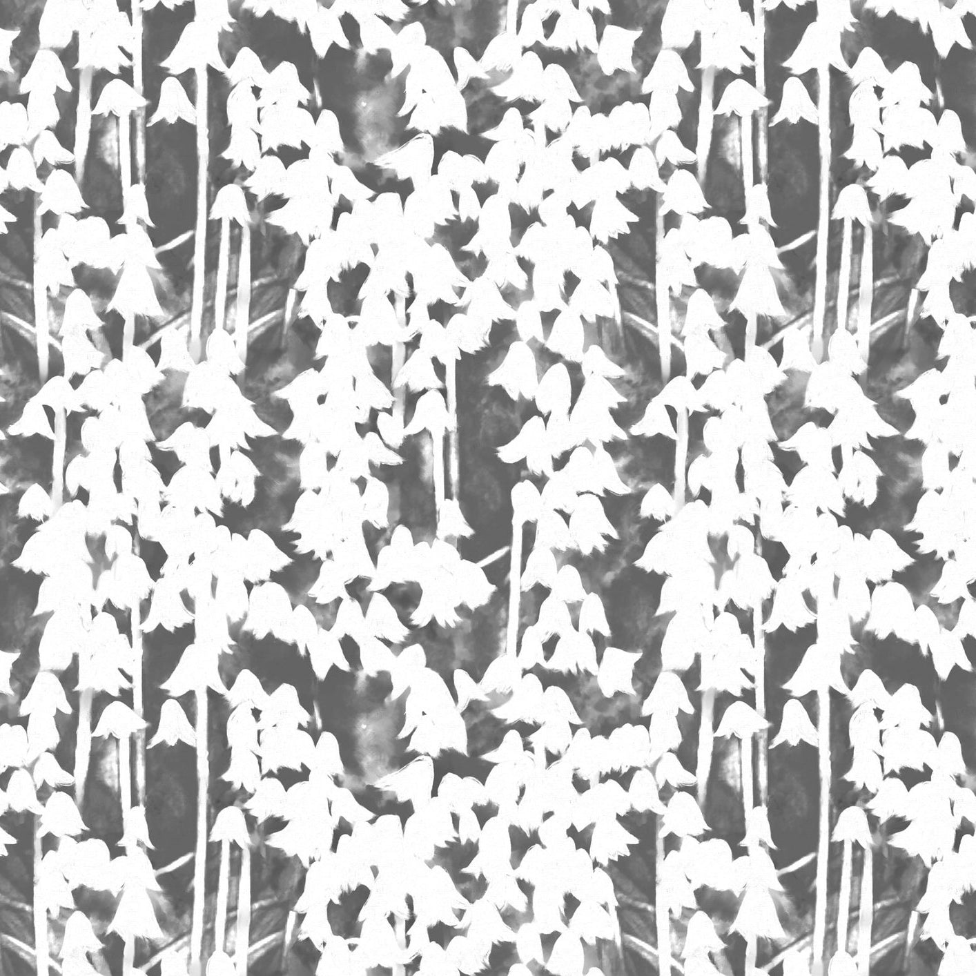 Detail of fabric in a painterly bluebell pattern in white on a mottled gray field.