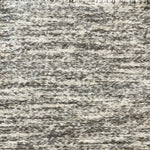 Textural bouclé broadloom carpet in heathered sage and white.