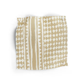 Textile with a beige and white geometric pattern on a white background