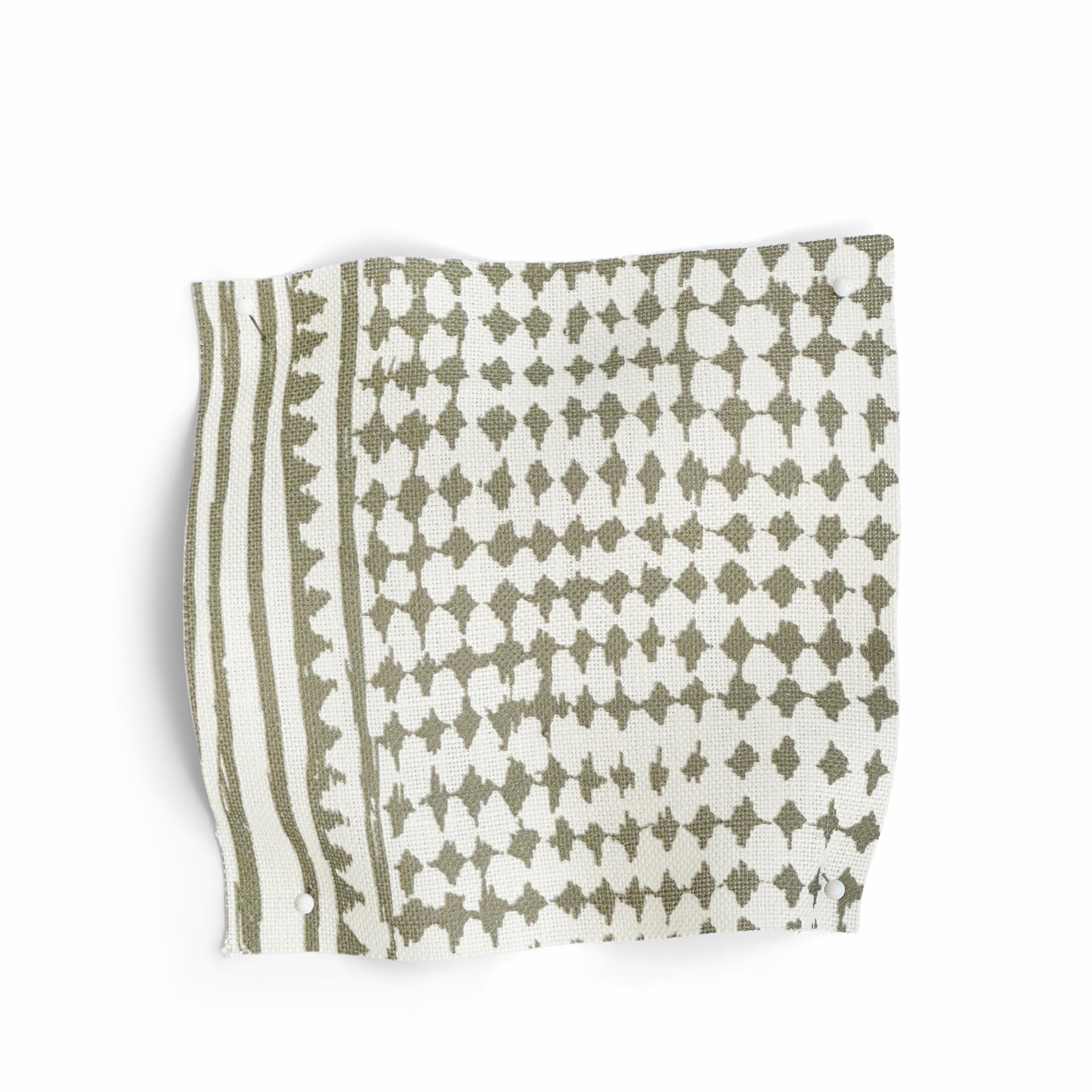 Textile with green geometric pattern on a white background