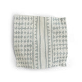 Patterned fabric swatch with blue and white geometric design on a white background