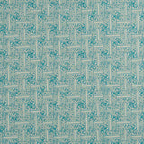 Detail of fabric in a geometric grid pattern in turquoise on a cream field.