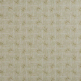 Detail of fabric in a geometric grid pattern in olive on a greige field.