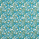 Detail of fabric in an abstract botanical print in blue, turquoise and gold on a white field.