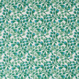 Detail of fabric in an abstract botanical print in green and turquoise on a white field.