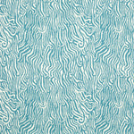 Detail of fabric in a playful animal print in blue on a white field.