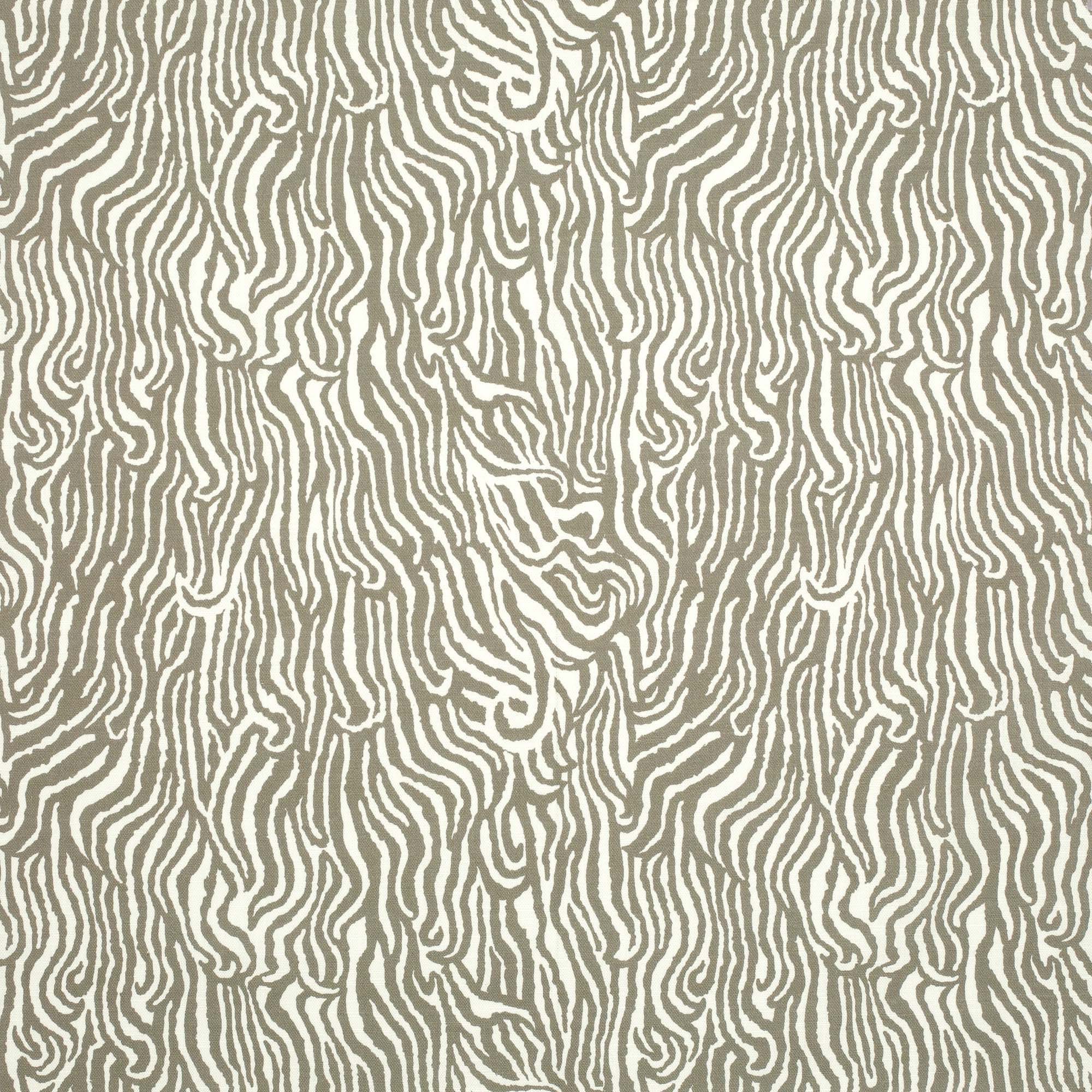 Detail of fabric in a playful animal print in light brown on a white field.