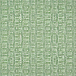 Detail of fabric in a playful curvy grid print in green on a white field.