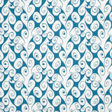 Detail of fabric in a playful abstract shape print in white on a blue field.