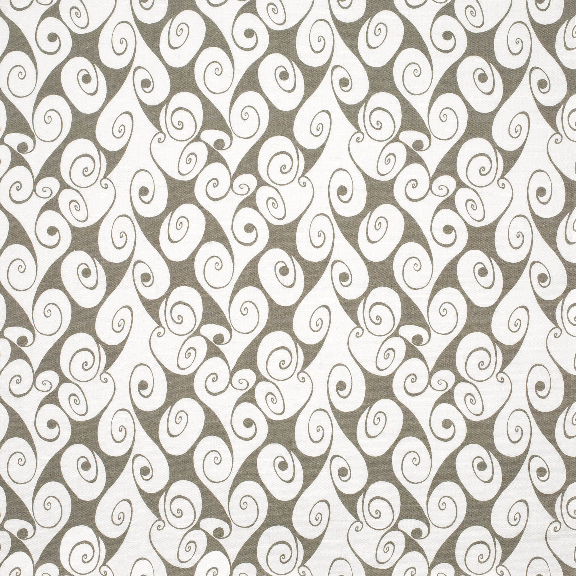 Detail of fabric in a playful abstract shape print in white on a light brown field.