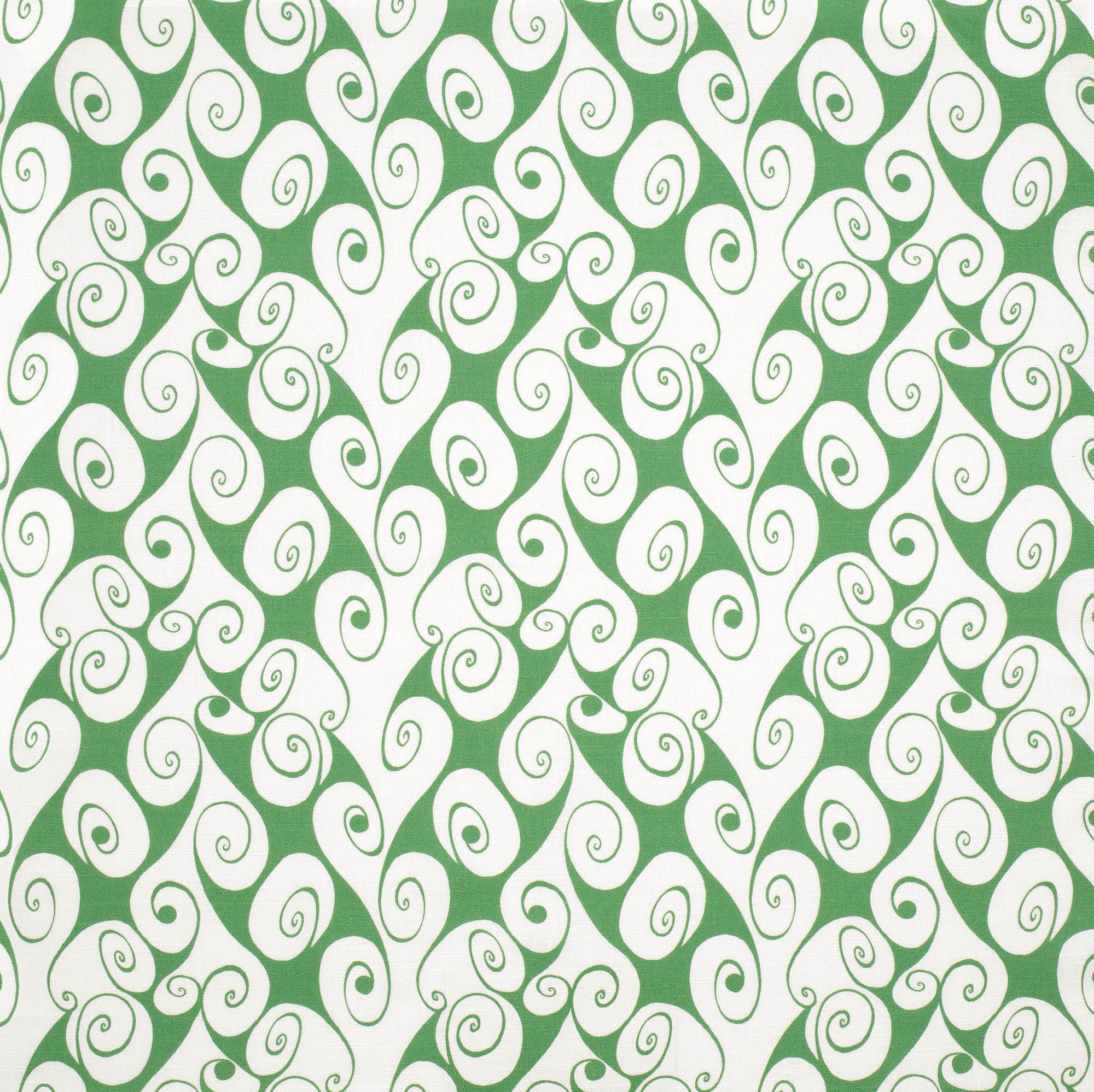 Detail of fabric in a playful abstract shape print in white on a light green field.