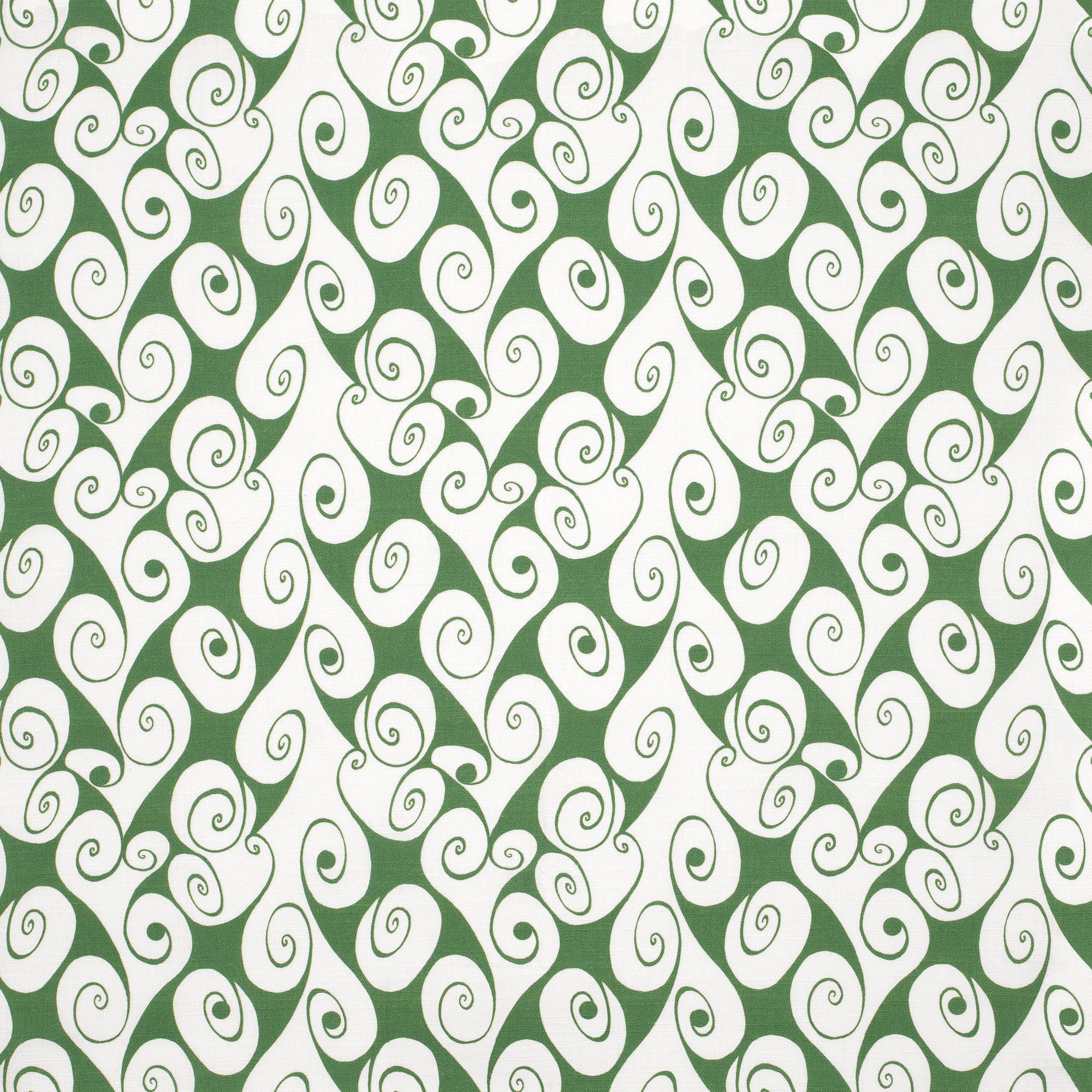 Detail of fabric in a playful abstract shape print in white on a green field.