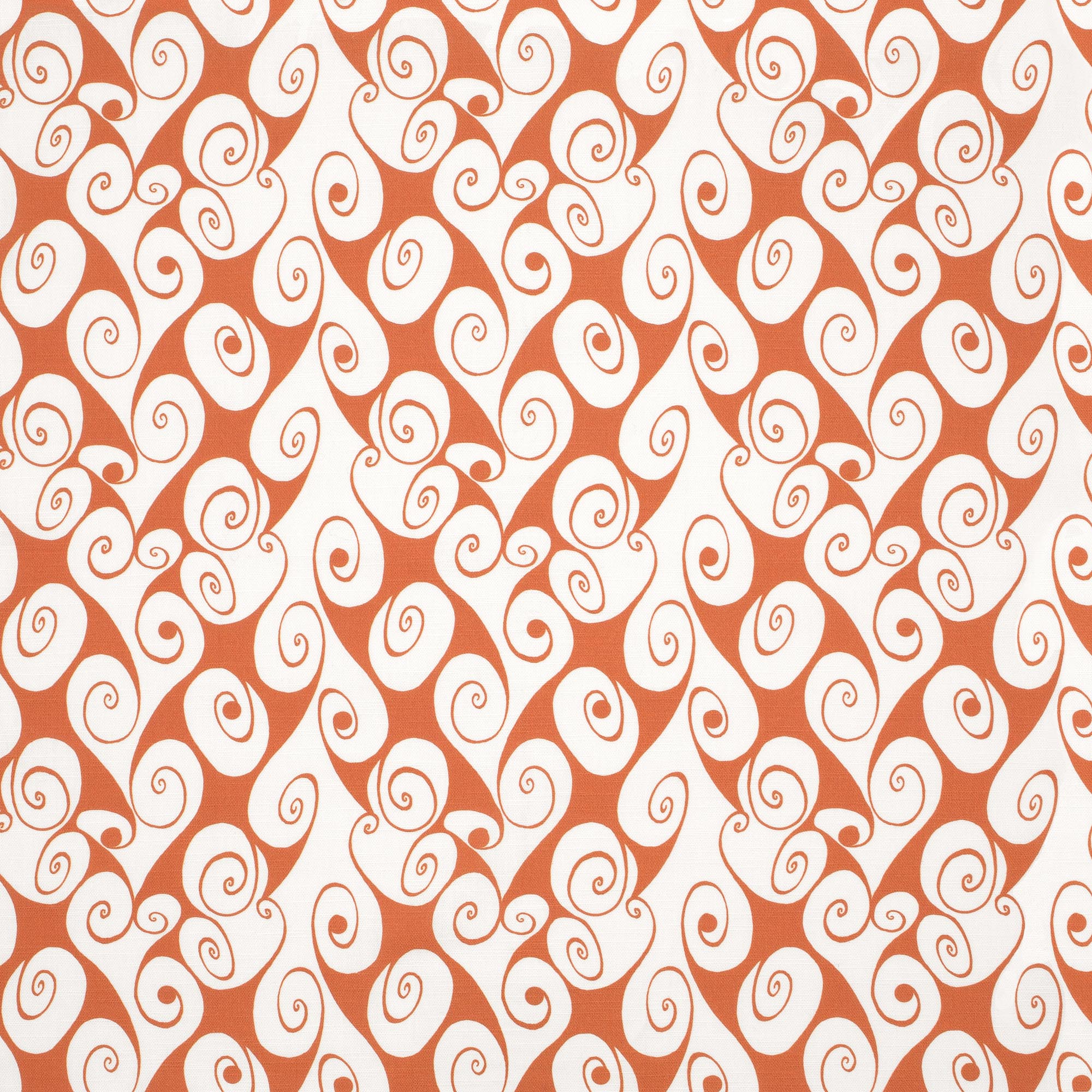 Detail of fabric in a playful abstract shape print in white on a burnt orange field.