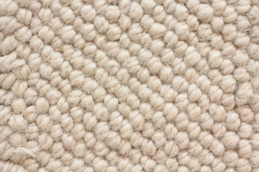 Broadloom carpet swatch in a textural pattern in a ivory design