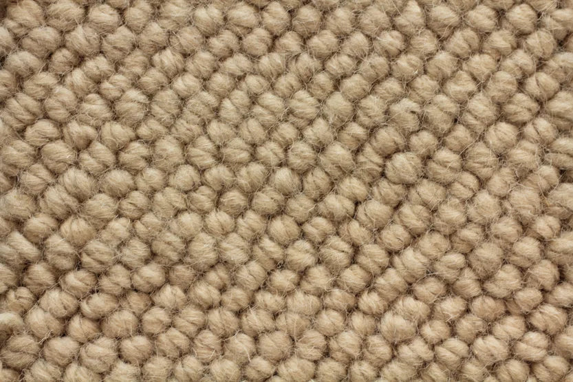 Broadloom carpet swatch in a textural pattern in a light tan design