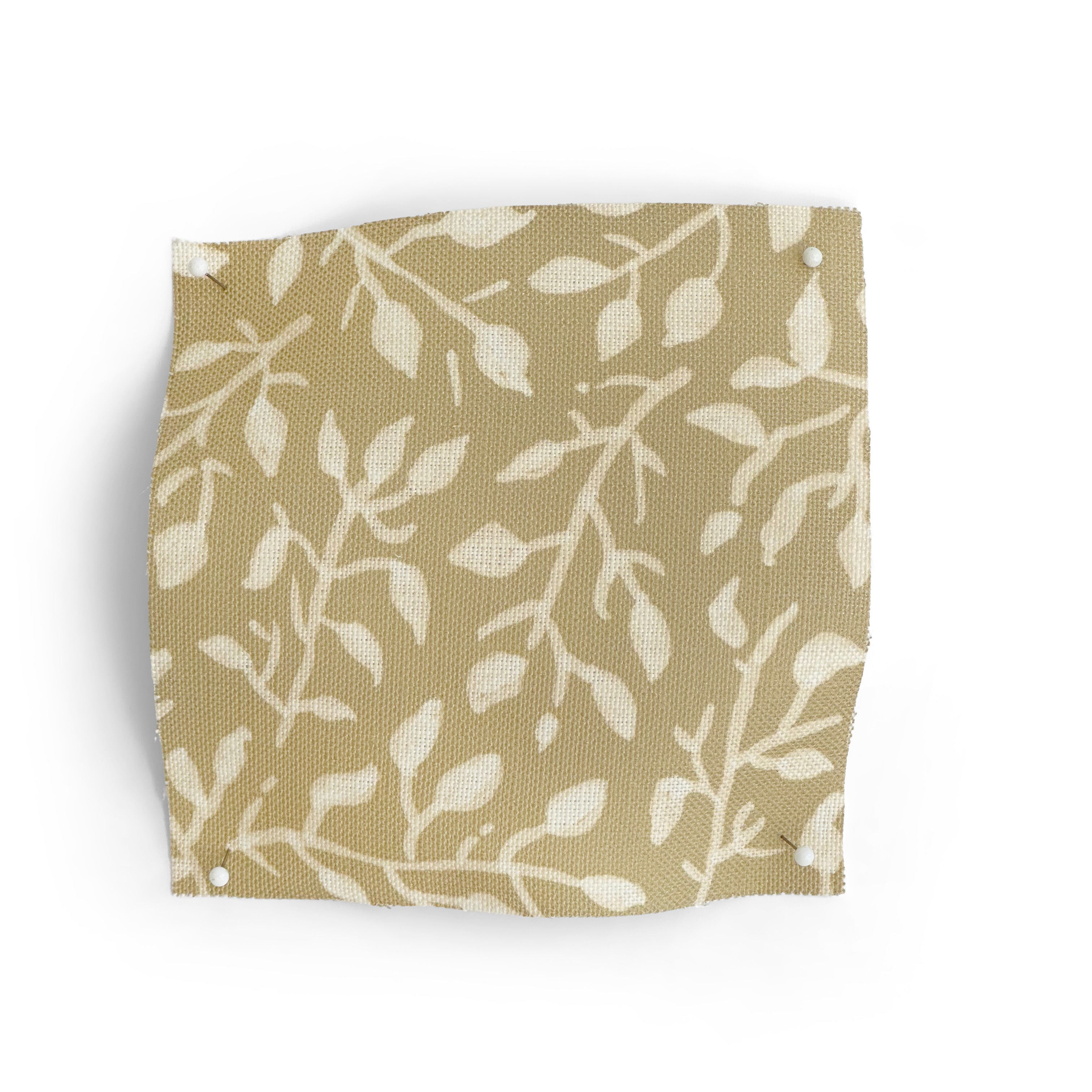 Fabric swatch with leaf pattern on a beige background