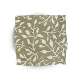 Fabric swatch with white leaf pattern on a green background