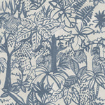 Detail of wallpaper in a playful jungle print in blue on a cream field.