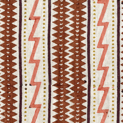 Woven fabric swatch in a pattern of different-shaped geometric stripes, lightning bolts and dots on a cream background.
