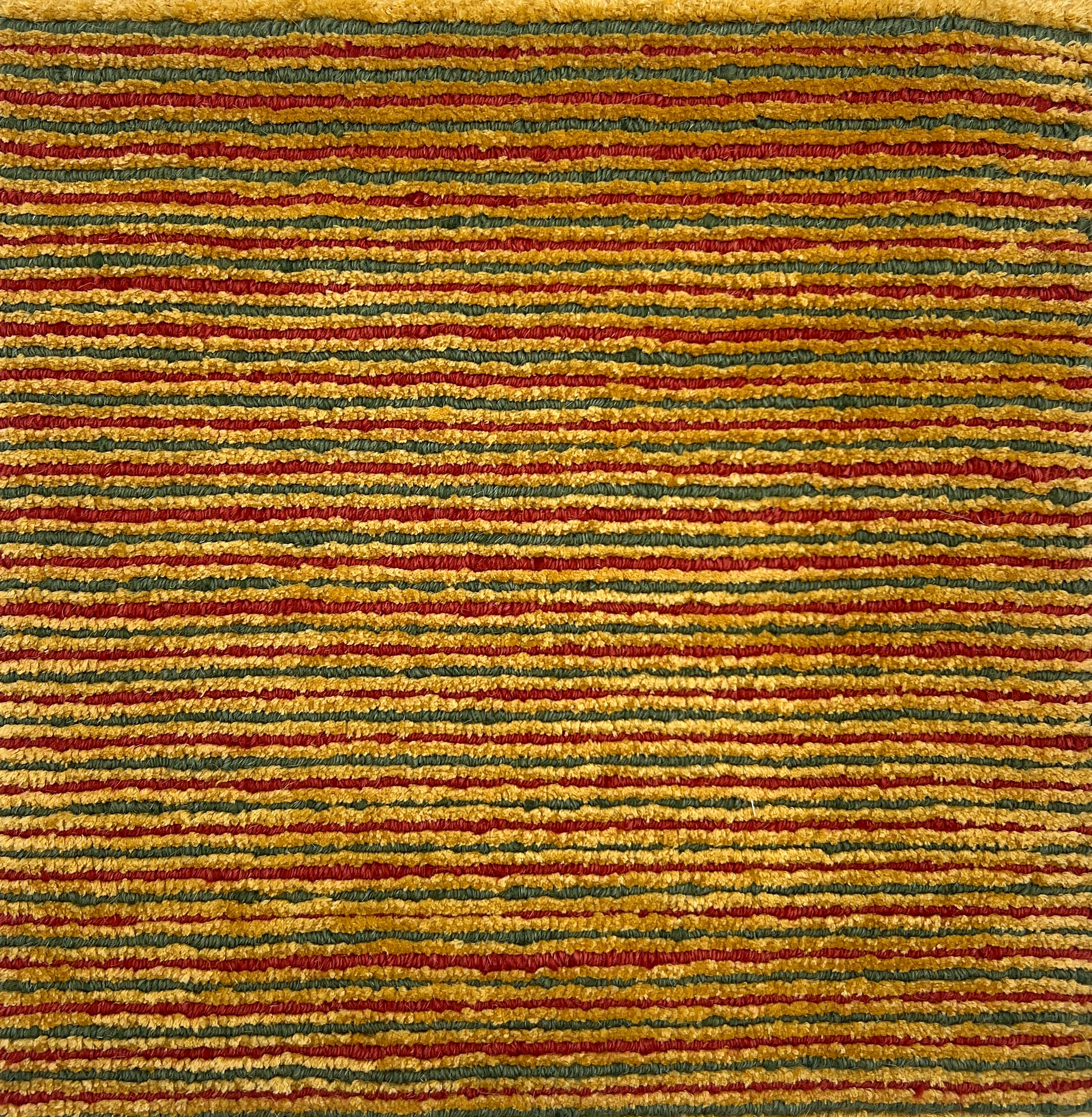 Handknotted rug in thin stripes of red, green and yellow. 