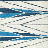 Handknotted rug sample in a modern herringbone design in shades of blue ona. white field. 