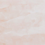 Detail of wallpaper in an abstract textural pattern in shades of white and pink.