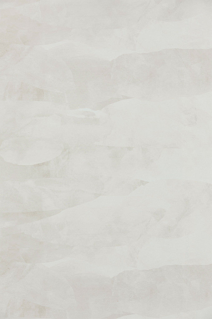 Detail of wallpaper in an abstract textural pattern in shades of gray and white.