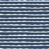 Detail of fabric in an undulating stripe pattern in blue and white on a navy field.
