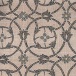 Detail of fabric in a floral lattice print in mottled blue and gray on a greige field.